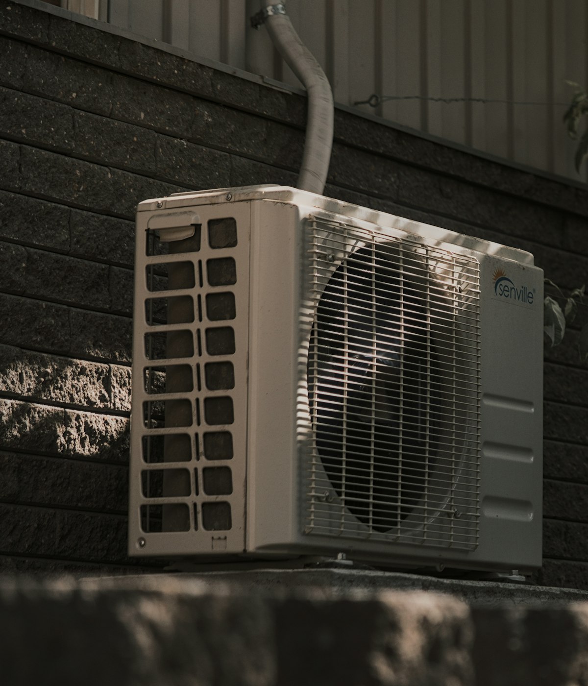 High-efficiency outdoor AC condenser unit installed at a Broward County home