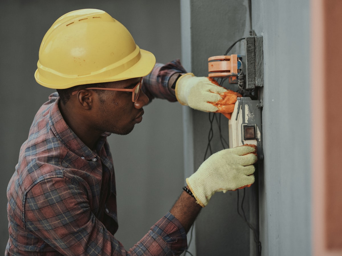 Elite Air Solutions technician servicing an air conditioning system in Broward County